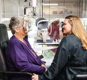 Optometrist Abby Ussher Toowoomba Optometrist Abby Ussher performing an eye exam with a female patient